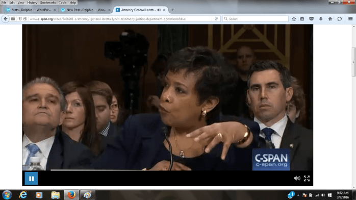 cspan.loretta.lynch.3.2016.guy with ear piece.png